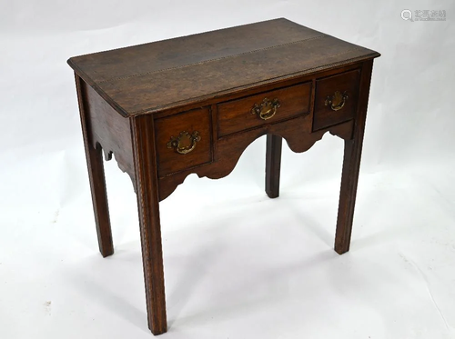 An 18th century oak three drawer side table