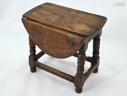 A small antique oak gateleg drop leaf coffee table