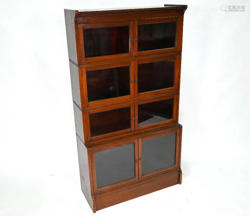 A four tier Lebus brand sectional mahogany bookcase