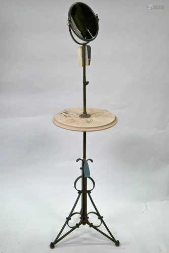 An old shaving stand on wrought steel base