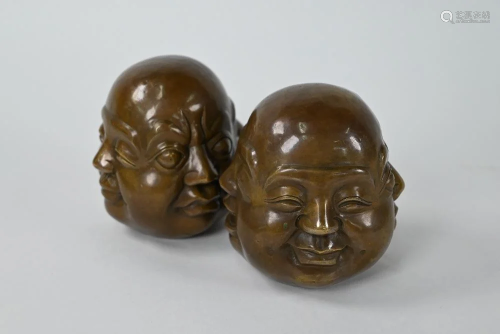 A pair of Oriental filled bronze four-faced Buddha