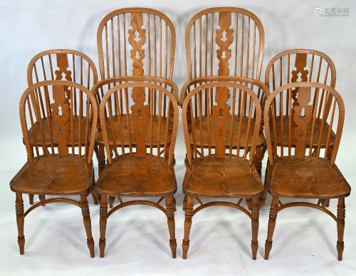 A traditional set of eight elm hoop back chairs