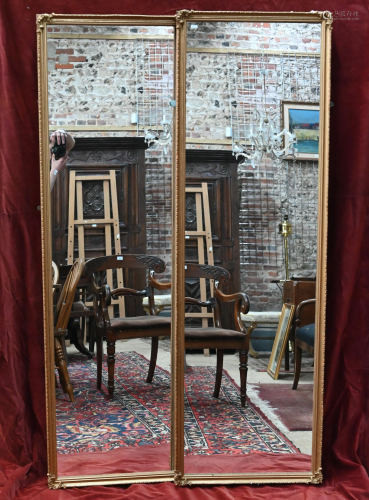 A pair of moulded gilt framed mirrors