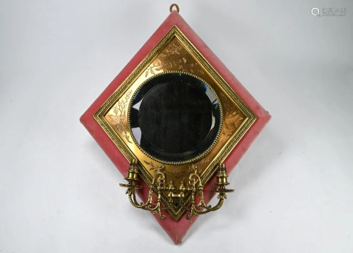 A diamond form twin branch mirror backed wall sconce