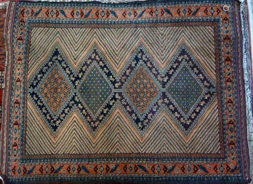An old Persian rug, multi-coloured design