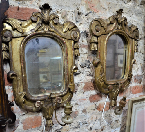 A near pair of antique mirror backed giltwood framed