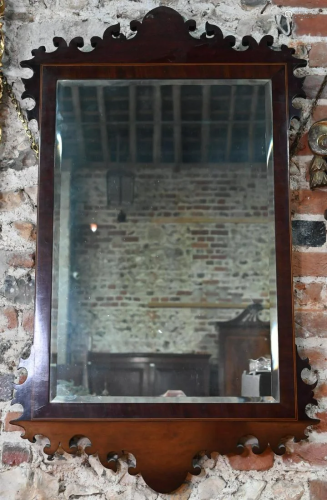 A George III mahogany fret framed mirror