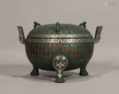 A CHINESE GILDED BRONZE TRIPOT DING