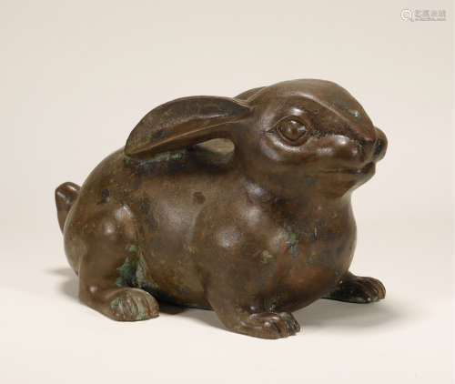 A CHINESE BRONZE RABBIT FIGURINE