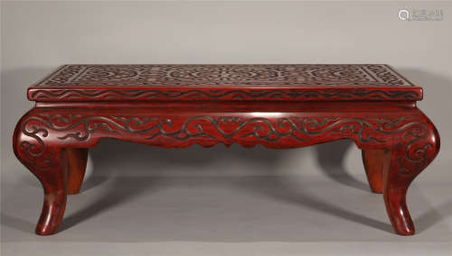 A CHINESE HAND-CRAFTEDED RED CINNIBAR TABLE