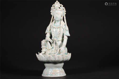 A CHINESE CELADON PORCELAIN BUDDHA STATUE