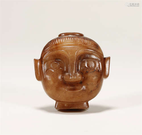 A CHINESE JADE HUMAN HEAD FIGURINE