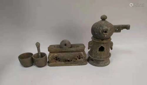 a group of chinese stone tea set