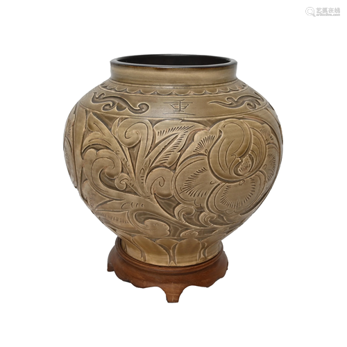 A Ming Style Incised Celadon Peony Jar.