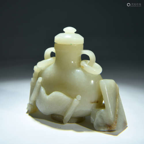 A Carved Jade Vase And Cover