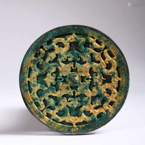 A Gilt-Inlaid Bronze Openwork Dragon Circular Mirror
