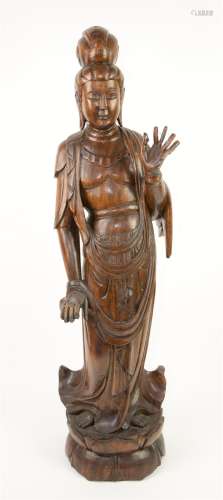 Chinese carved hardwood figure of Guanyin, on integral lotus...