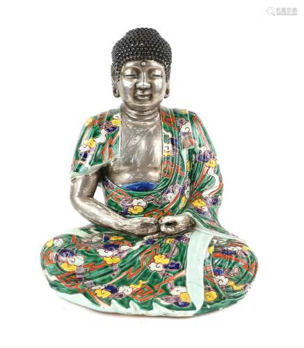 Chinese porcelain figure of Buddha seated in full lotus posi...