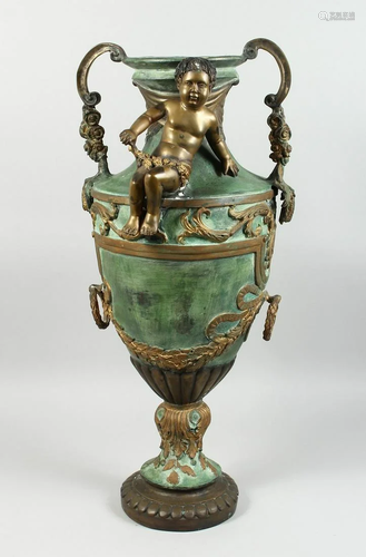 A BRONZE TWO HANDLED URN with cupid, acanthus scroll