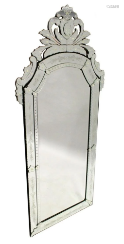 A LARGE VENETIAN MIRROR, bevelled glass in a scrolling