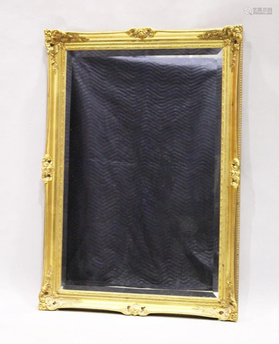 A GILT FRAMED UPRIGHT BEVELLED MIRROR, 3 ft. 5 in.