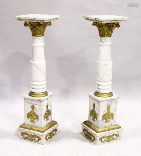 A GOOD PAIR OF WHITE VEINED MARBLE TORCHERES with