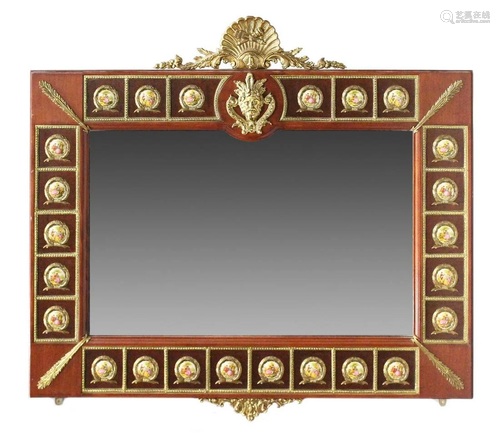 A MIRROR IN THE LOUIS XVI STYLE, INSET WITH PORCELAIN