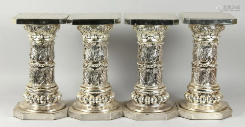 A SET OF FOUR SILVERED SQUARED TOP STANDS on octagonal