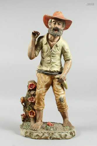 A POTTERY MAN FROM THE OUTBACK, 20 ins. high.