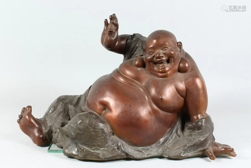 A LARGE BRONZE BUDDHA 20 ins long.