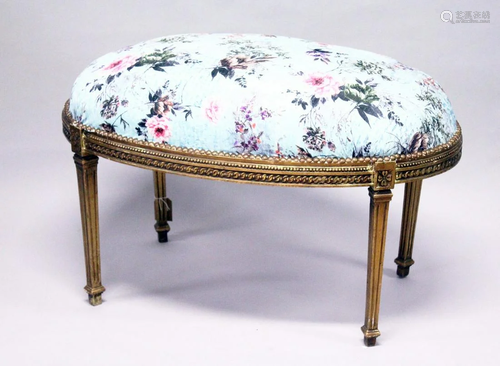 A GILT WOOD LARGE STOOL, upholstered with a floral