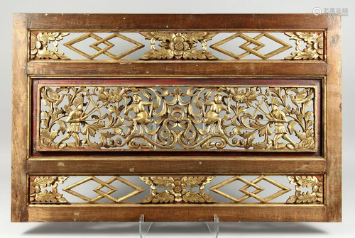 A CHINESE PIERCED AND GILDED PANEL 37 ins x 23 ins.