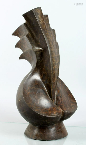 A BRONZE ABSTRACT SCULPTURE 17 ins high.