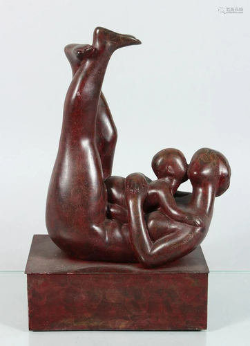 A MODERN BRONZE MOTHER AND CHILD on a rectangular base.