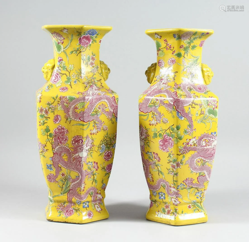 A PAIR OF YELLOW DRAGON DESIGN OCTAGONAL VASES 17 ins