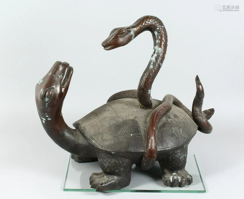 A BRONZE TURTLE being attacked by a snake 18 ins