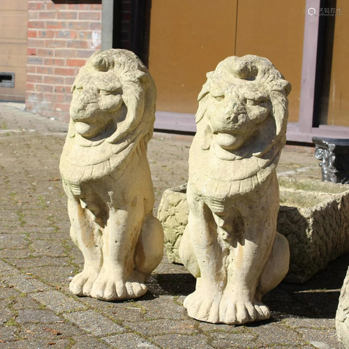 A PAIR OF COMPOSITE FINIALS, modelled as lions. 26.5