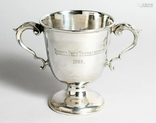 A POLO TROPHY, TWO HANDLED PEDESTAL CUP, 5 ins high,