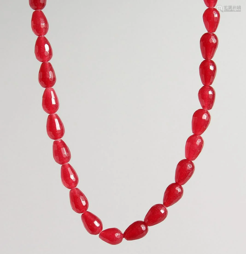 A STRING OF CHERRY AMBER BEADS