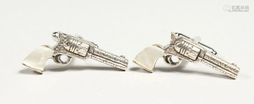 A PAIR OF SILVER AND MOTHER OF PEARL PISTOL CUFF LINKS