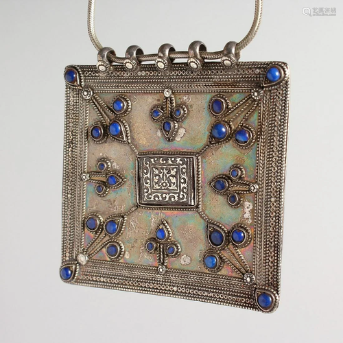 A LARGE ISLAMIC SILVER AND BLUE LAPIZ SQUARE PENDANT