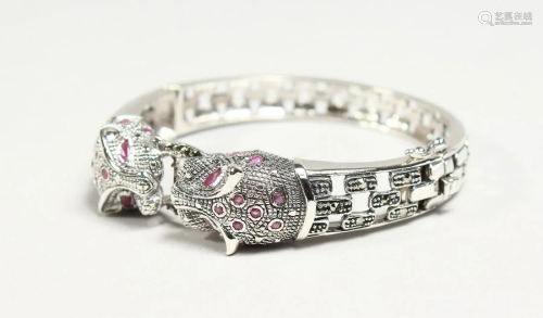 A SILVER AND RUBY SET PANTHER HEAD BRACELET