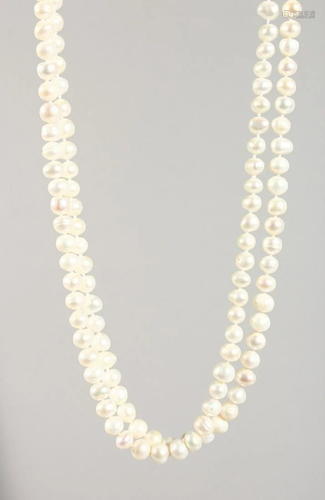 A LONG STRING OF WHITE PEARLS 48 ins long