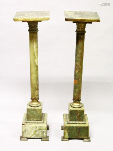 A PAIR OF ONYX AND ORMOLU PEDESTAL COLUMNS, with