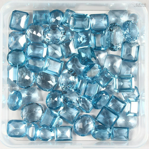 A BOX OF AQUAMARINE STONES