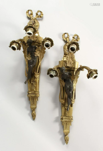 A PAIR OF CAST BRASS THREE BRANCH WALL APPLIQUES, with