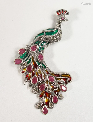 A SILVER RUBY SET PEACOCK BROOCH
