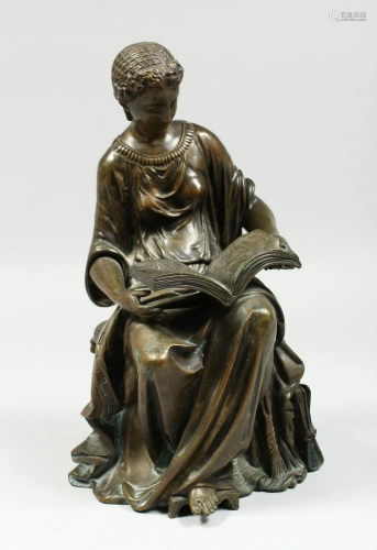 A CLASSICAL BRONZE SEATED FIGURE reading a book, 10 ins