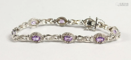 A SILVER AMETHYST AND CZ BRACELET.