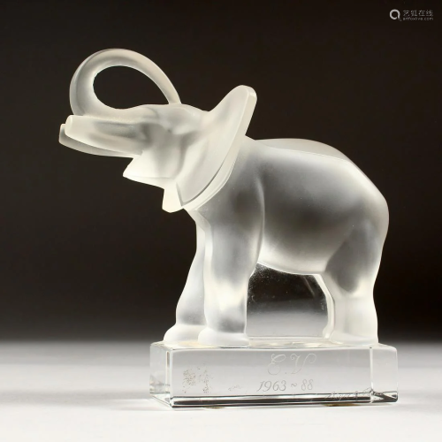 A LALIQUE CRYSTAL ELEPHANT on a glass base